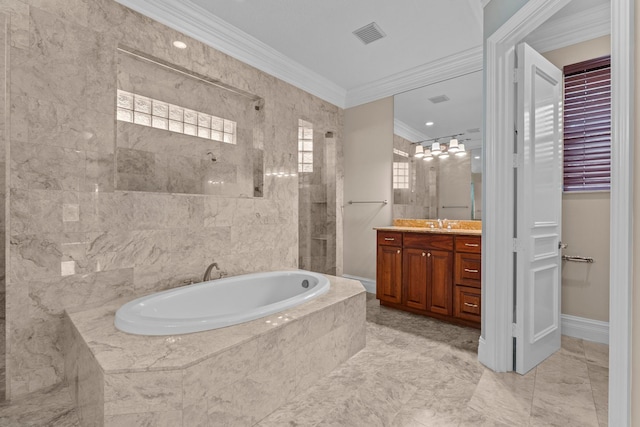 bathroom with vanity, tiled bath, crown molding, tile walls, and tile floors