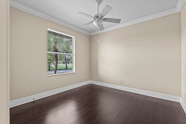 empty room featuring ceiling fan, ornamental molding, dark wood-type flooring, and a textured ceiling