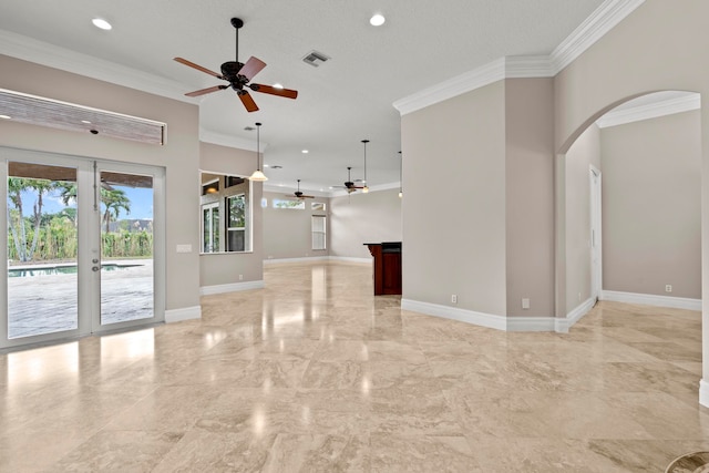 tiled empty room with ceiling fan, a textured ceiling, crown molding, and french doors