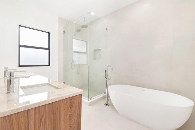 363 31st Ct, West Palm Beach, FL 33407 - full bath featuring a freestanding bath, a shower stall, and vanity
