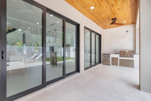 363 31st Ct, West Palm Beach, FL 33407 - view of patio with area for grilling, ceiling fan, a sink, and grilling area