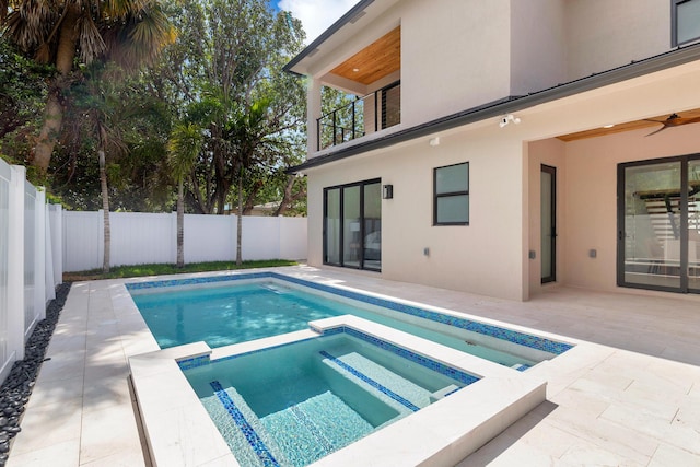 363 31st Ct, West Palm Beach, FL 33407 - view of pool featuring a fenced backyard, a patio area, ceiling fan, and a pool with connected hot tub