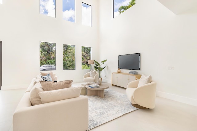 363 31st Ct, West Palm Beach, FL 33407 - living room with a towering ceiling and baseboards