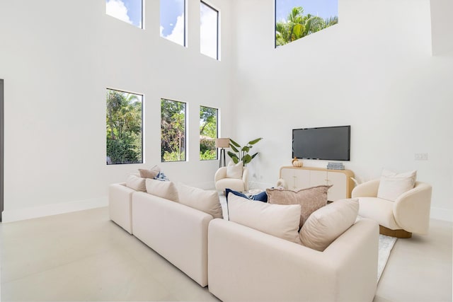 363 31st Ct, West Palm Beach, FL 33407 - living area featuring a high ceiling and baseboards
