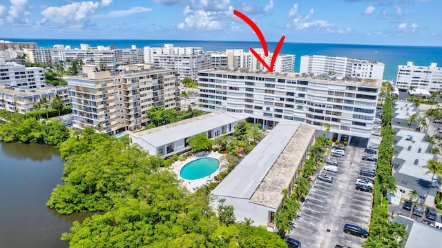 birds eye view of property with a water view