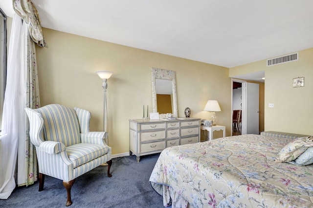 bedroom featuring dark colored carpet