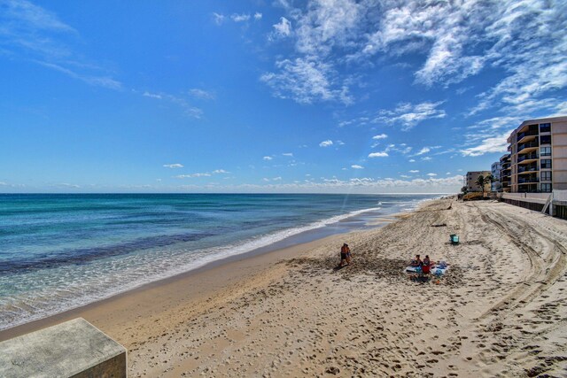 property view of water featuring a beach view