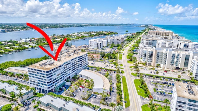 birds eye view of property with a water view