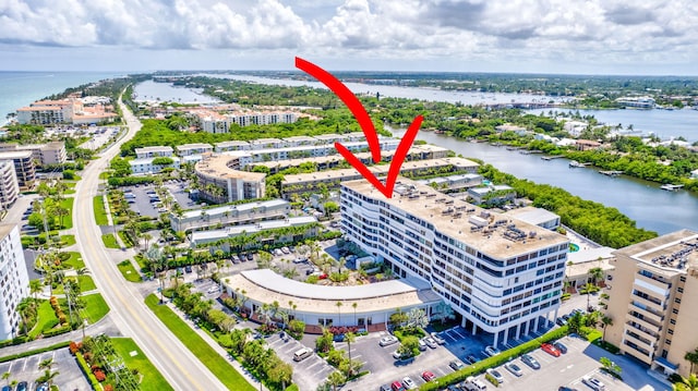 birds eye view of property featuring a water view