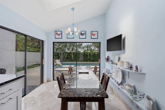 dining area featuring high vaulted ceiling, light tile floors, and a chandelier