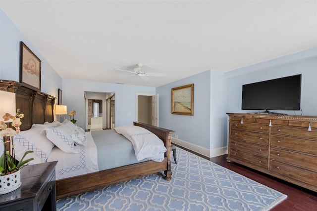 bedroom with ceiling fan and dark hardwood / wood-style flooring