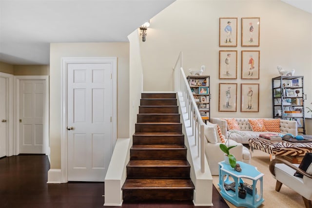 stairway featuring dark wood-type flooring