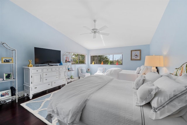 bedroom with vaulted ceiling, ceiling fan, and dark hardwood / wood-style flooring