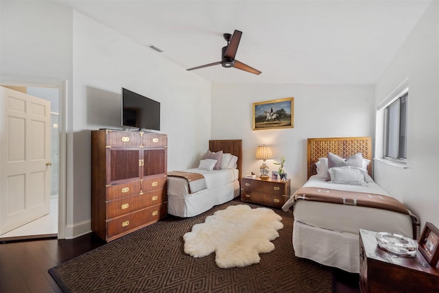 bedroom with lofted ceiling, ceiling fan, and dark hardwood / wood-style flooring