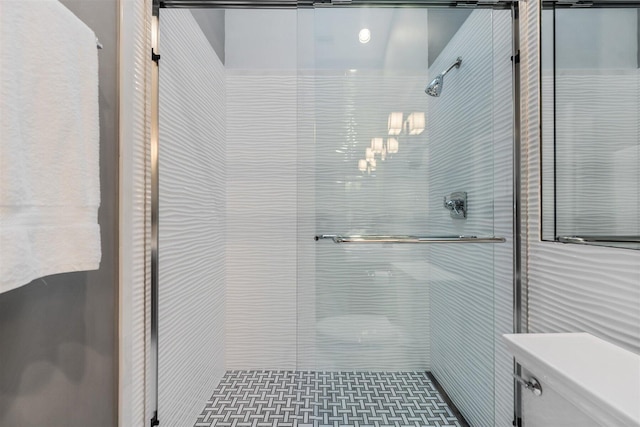 bathroom with a shower with shower door, toilet, and tile walls