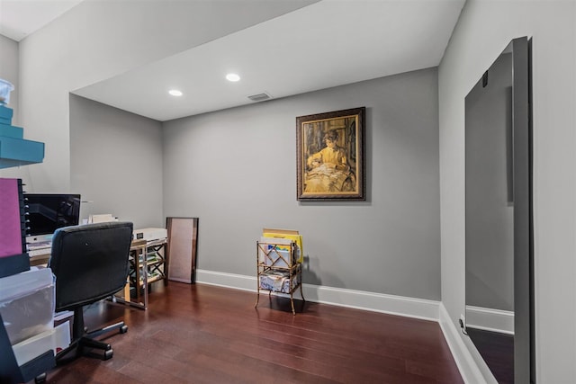 office space with dark wood-type flooring