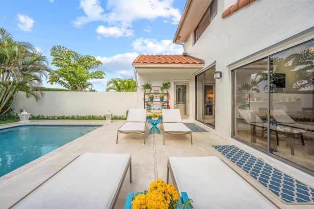 view of swimming pool with a patio