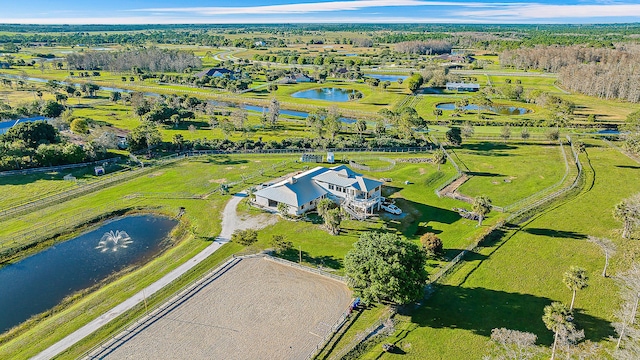 drone / aerial view featuring a rural view and a water view