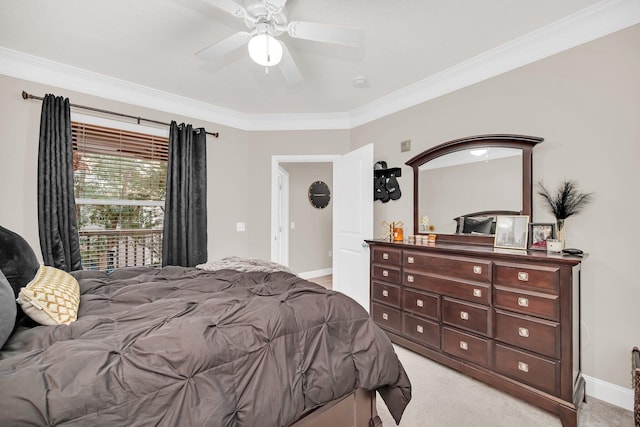 bedroom featuring light carpet, ceiling fan, baseboards, and crown molding