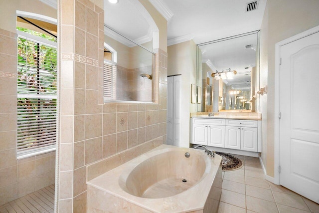 bathroom with plus walk in shower, tile patterned floors, crown molding, and vanity