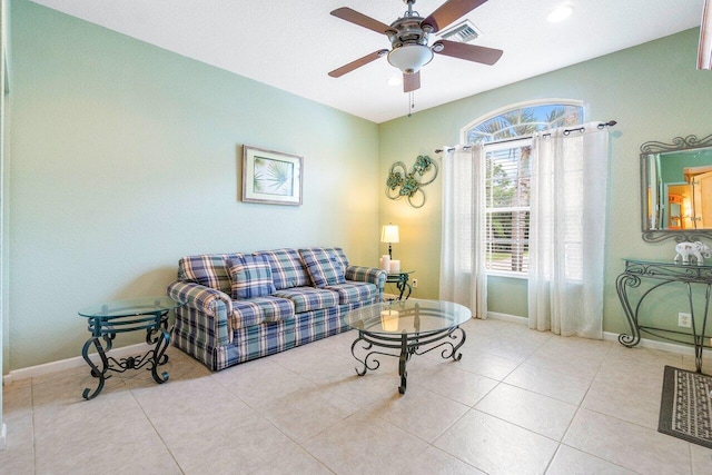 living room with ceiling fan and light tile patterned floors