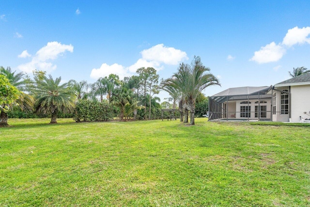 view of yard featuring a lanai