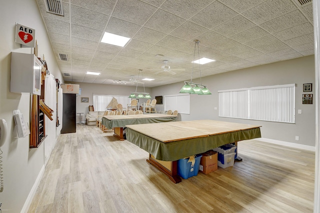 recreation room featuring pool table, light hardwood / wood-style floors, and a drop ceiling