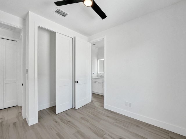 unfurnished bedroom with a closet, ceiling fan, and light wood-type flooring