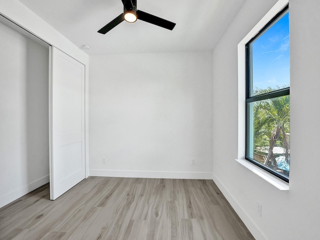 unfurnished room featuring light hardwood / wood-style floors and ceiling fan