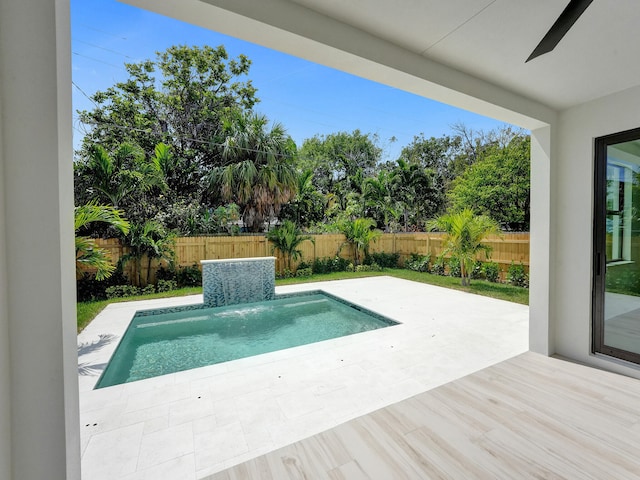 view of pool featuring a patio area and pool water feature