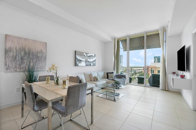 tiled living room featuring a wall of windows