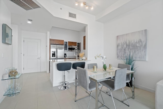 dining room featuring light tile patterned flooring