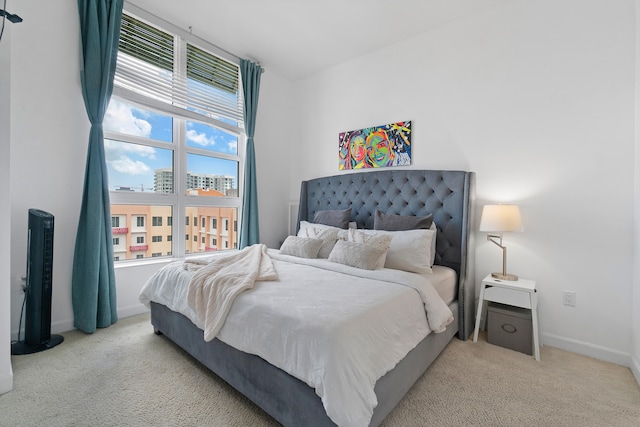 bedroom with light colored carpet