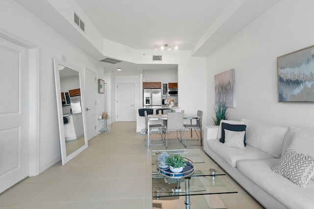 living room featuring light tile patterned floors