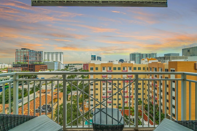 view of balcony at dusk