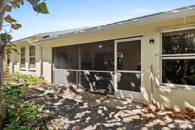 back of property featuring a sunroom