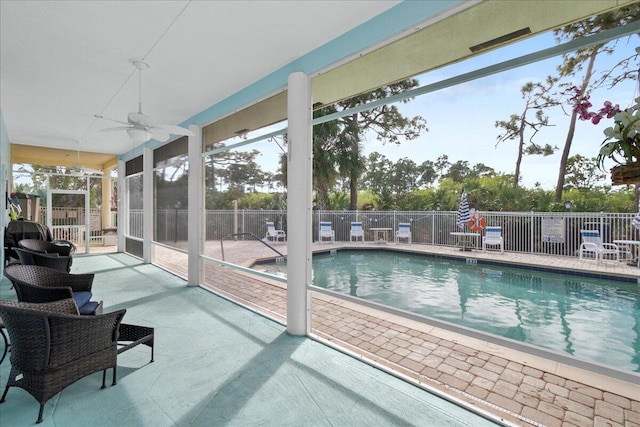 view of pool with ceiling fan and a patio