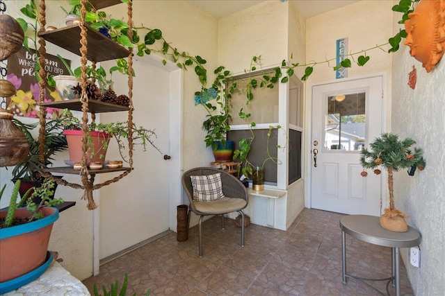 foyer entrance with tile flooring