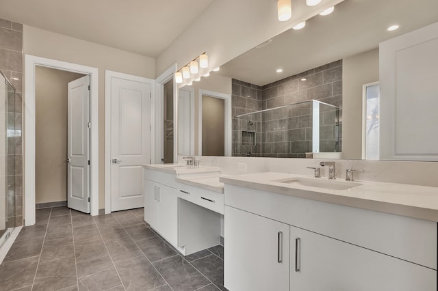 bathroom featuring tile patterned floors, vanity, and walk in shower