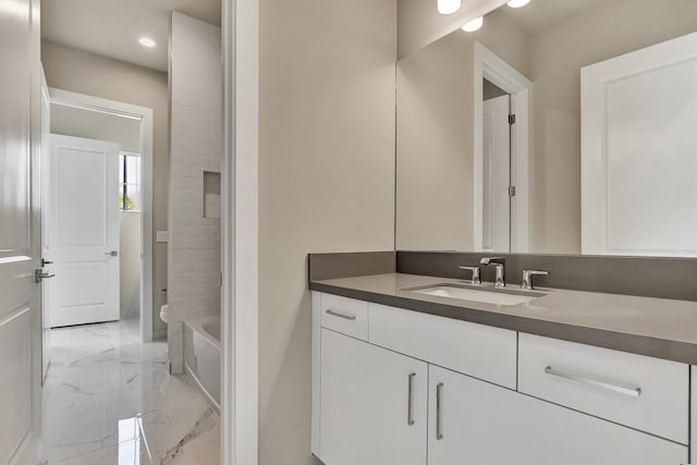 bathroom with vanity and toilet