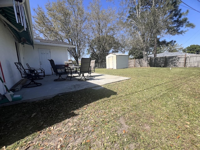 view of yard with a patio area and a shed