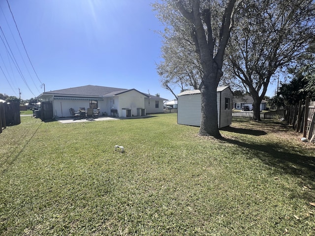 view of yard with a patio area and an outdoor structure