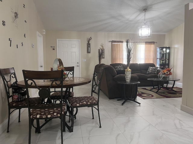 tiled dining area with a notable chandelier