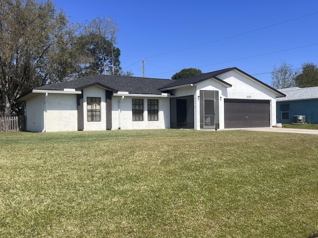 ranch-style house featuring central air condition unit, a front lawn, and a garage