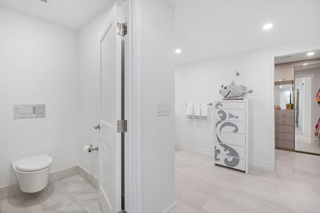 bathroom with tile floors and toilet