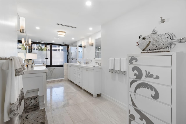 bathroom featuring tile floors and vanity