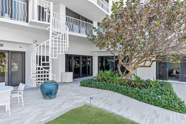 exterior space featuring a balcony and a patio