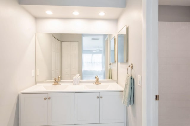 bathroom featuring double vanity