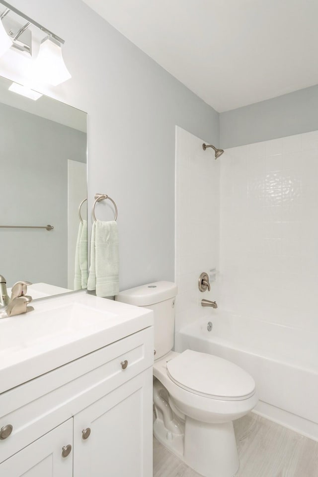 full bathroom with vanity, shower / washtub combination, and toilet