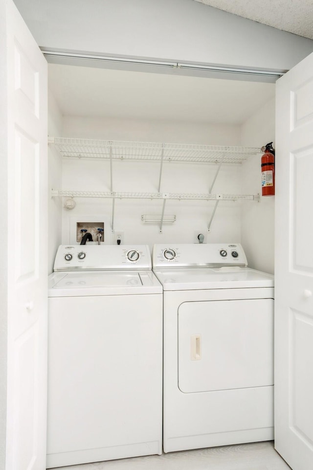 laundry area featuring hookup for a washing machine and washer and clothes dryer